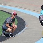 A coach watching a rider on the track